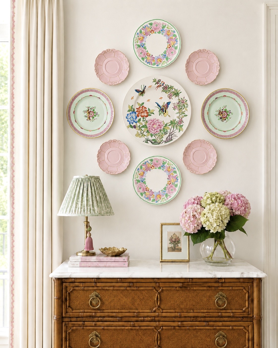 Pastel plate wall above a bamboo chest